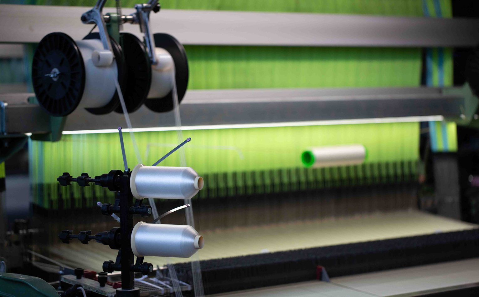 Loom with green silk weaving