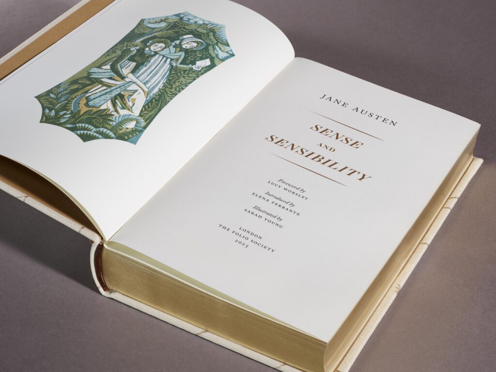 One book from collection of Jane Austen, front page opened showing title 'Sense and Sensibility' and a drawing
