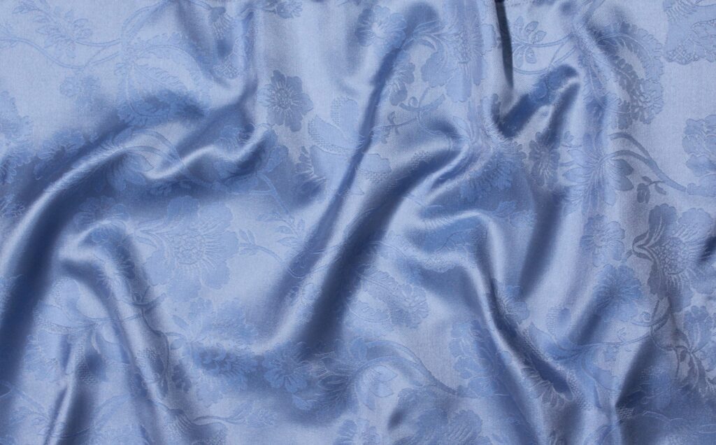 A pale blue delicate floral silk fabric