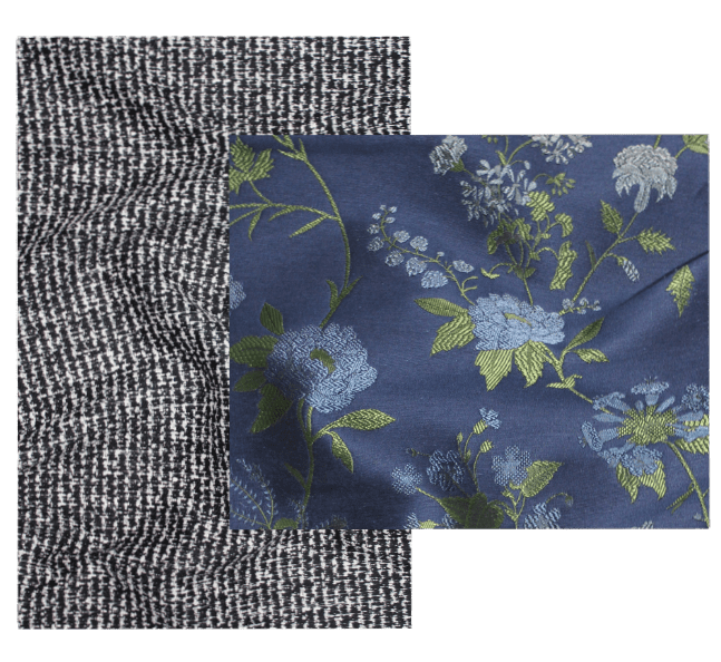 A plain grey wool fabric laid underneath a blue floral silk