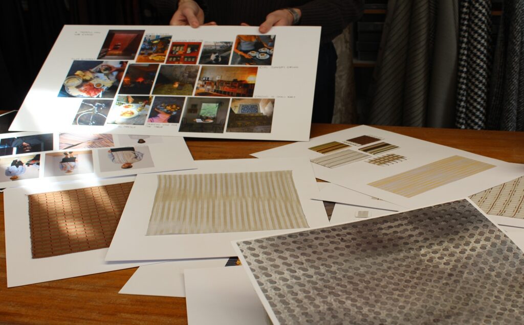 Central Saint Martins Student Moodboards scattered on a wooden table