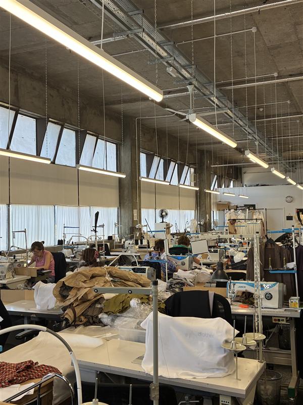 A production line of sewing machine stations at Maes London.