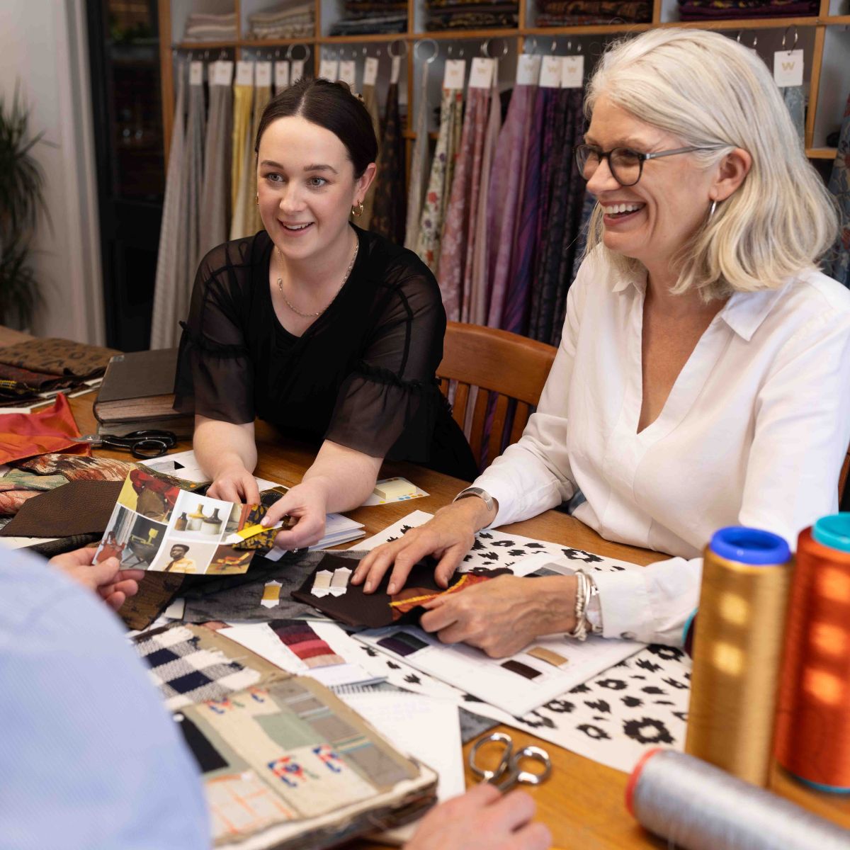 Two Stephen Walters Account Managers hosting a customer meeting in the showroom.